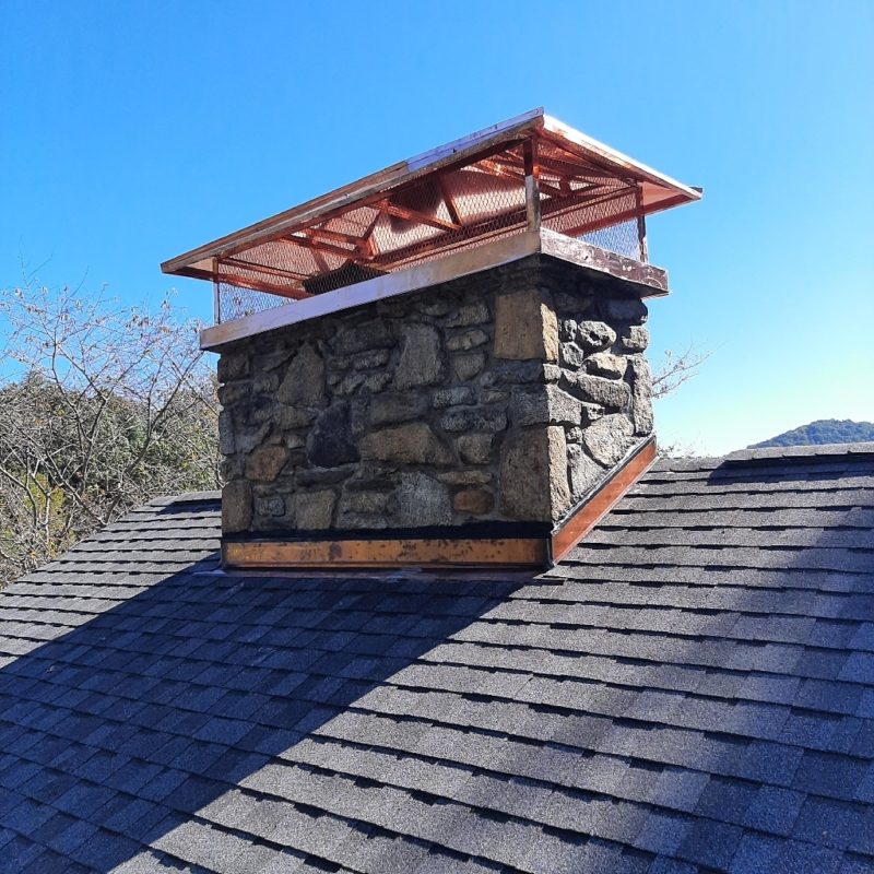 Warmstead WNC Stone Chimney with Custom Copper Chimney Cap Installation